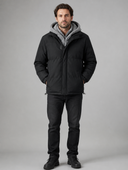 Man in black padded winter jacket with gray fleece hood, front view