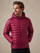 Man in burgundy lightweight padded jacket with hood, three-quarter view